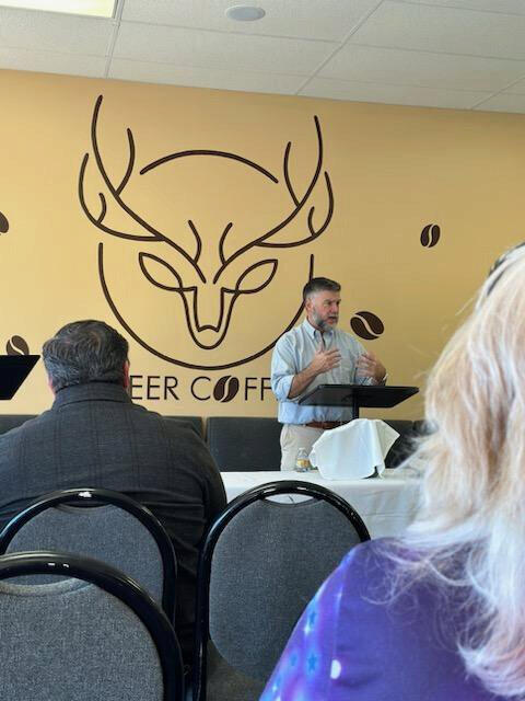 People listening to a preacher at Covenant Chapel, a Ripley, TN church.